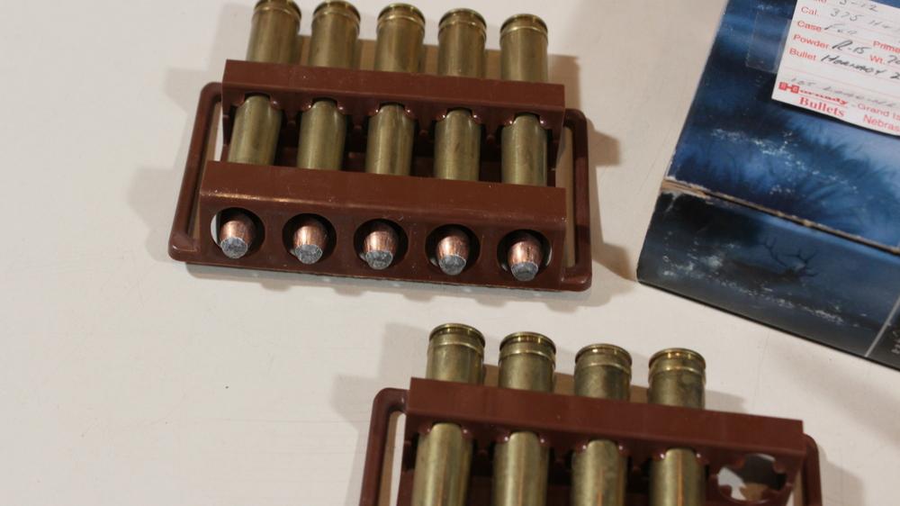 12 rnds 375 H&H and 8 empty brass
