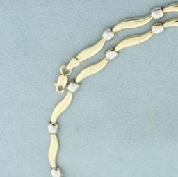 17 Inch Two Tone Alternating Swirl And Box Design Necklace In 14k Yellow And White Gold