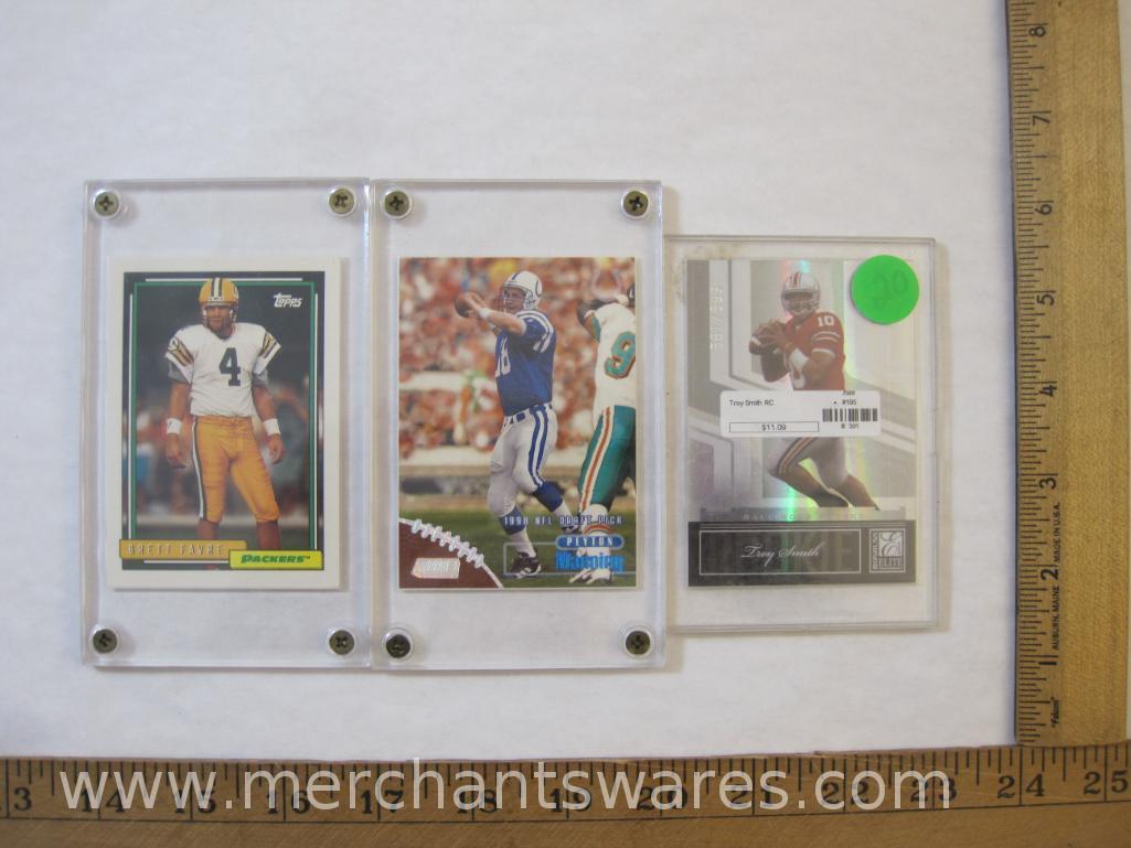 Three NFL Trading Cards including Donruss Troy Smith Serial Numbered 561/599, 1992 Topps Brett Favre
