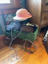 small decorative wagon, full of antique HATS with an antique Hat display