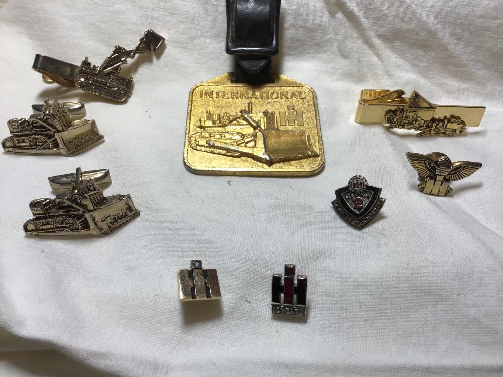 Lot International Harvester pins and leather