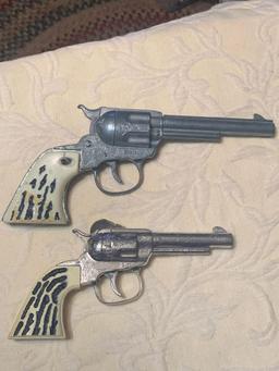 Two Toy Cap Guns