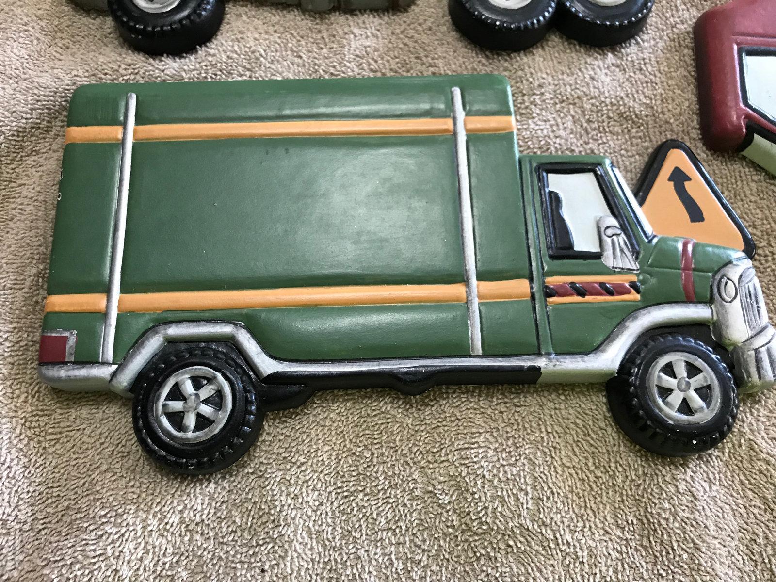 Wall hanging trucks, approx 8 inches long each