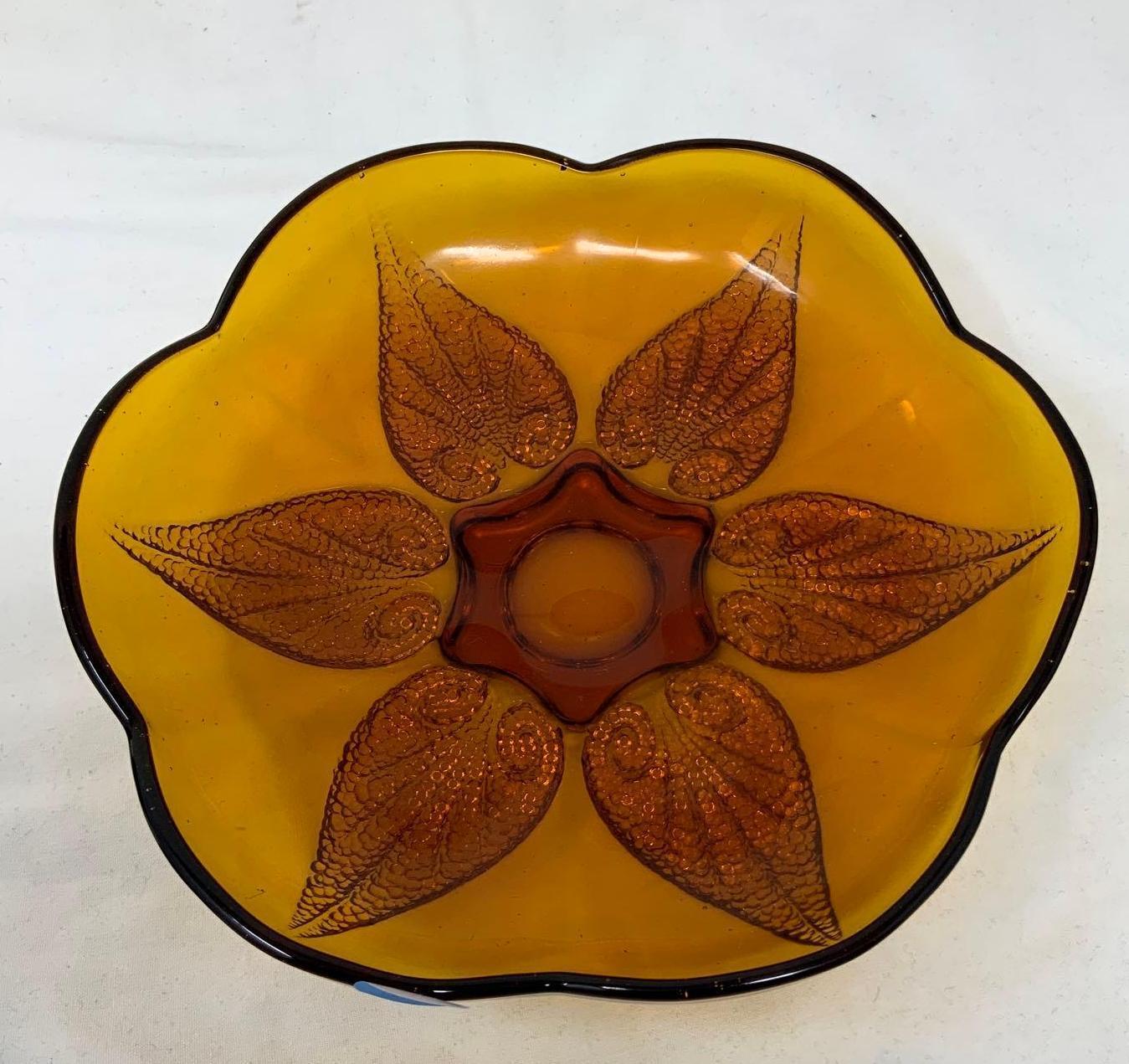 Two vintage carnival glass toothpick holders and one amber dish