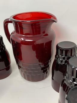 Vintage red pitcher and fifteen glasses