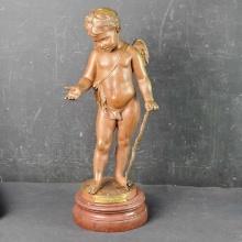 Bronze Cupid sculpture on rough red marble base stamped Medaille D'Argent signed D. Debut