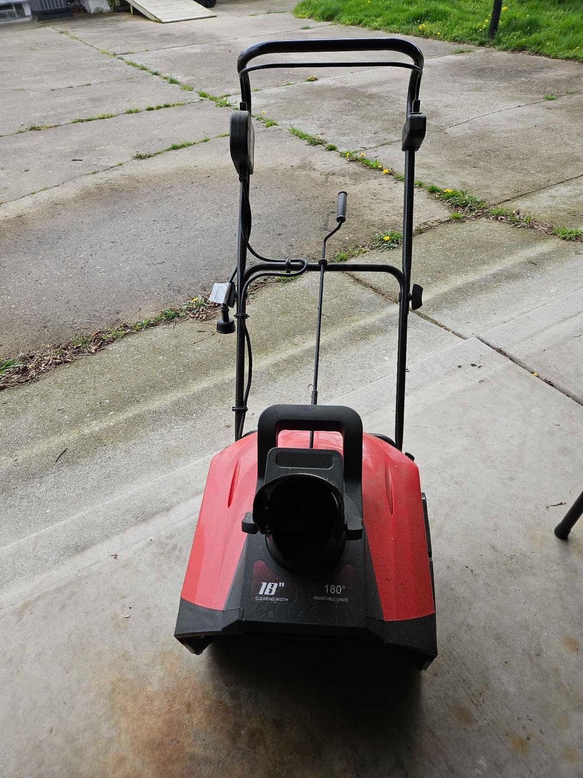 Electric snow thrower.