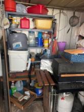Shelf with contents, grill, and shed