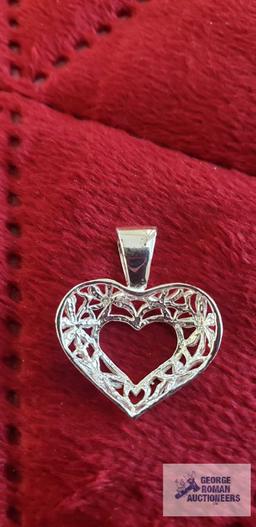 Silver colored heart pendant, marked 925, approximate total weight is 1.91 G