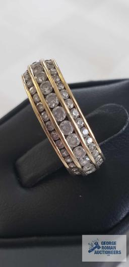 Gold and clear gemstone band gemstones all the way around three rows, marked SW 14K DQCI, total