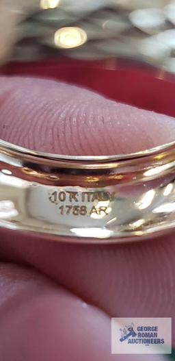 Gold colored band, marked 10K Italy, approximate total weight 1.0 G