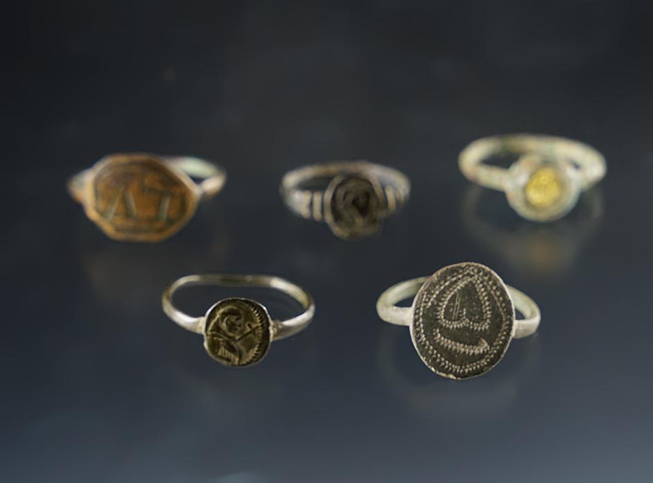 Set of 5 Trade Rings, one with a glass bezel. Townley Reed Site, Geneva, New York.