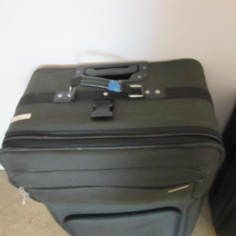 Two Black Soft Side Protocol Rolling Suitcases