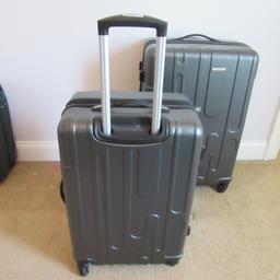Two Samsonite 360 Turn Rolling Suitcases