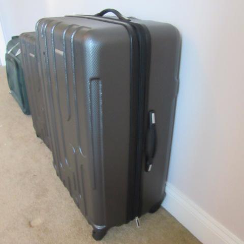Two Samsonite 360 Turn Rolling Suitcases