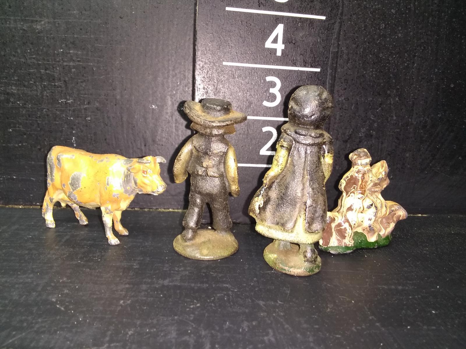 Collection of Four Vintage and Cast Iron and Metal Toys