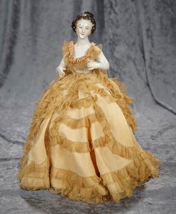 13"overall. German porcelain half doll with arms extended, as pincushion. $300/400