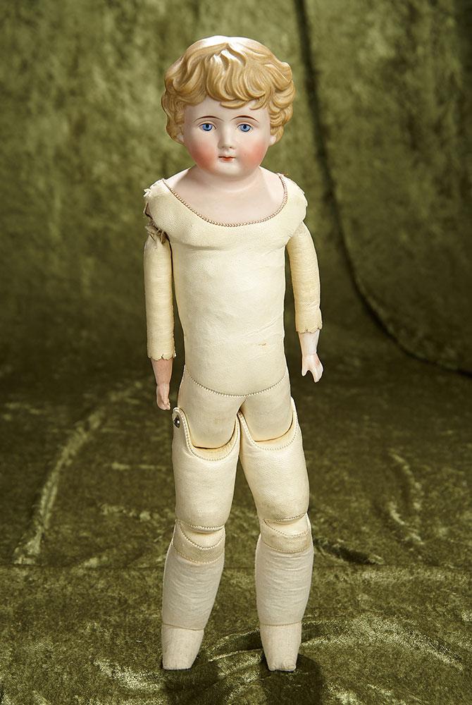 17" German bisque doll with sculpted blonde hair. $300/400
