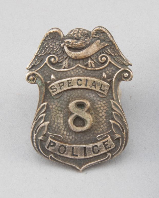 Special Police, #8 Badge, shield with eagle crest, 2" T, ornate.  George Jackson Collection.