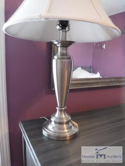 Silver-colored lamp with shade