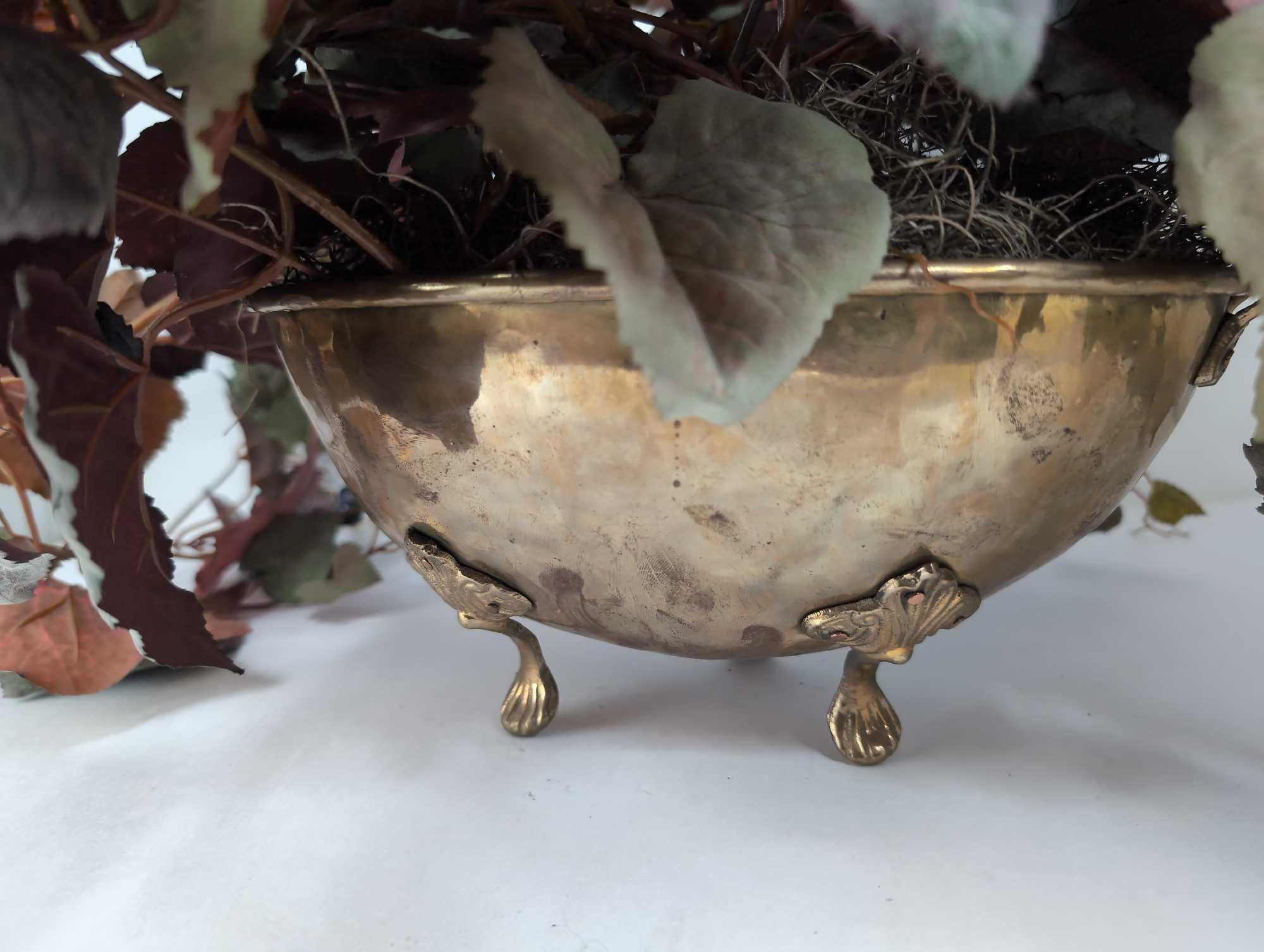 (LR) VINTAGE BRASS TWO HANDLED BOWL WITH SHELL MOTIFF FEET & FAUX. FOLIAGE. IT MEASURES APPROX. 12"W