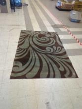 MACHINE MADE AREA RUG, BROWN AND GREY. STAINED, 58 1/4"X85"