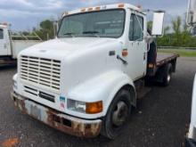 1999 INTERNATIONAL 4700 FLATBED TRUCK VN:1HTSMABM3XH674645 powered by T444E diesel engine, equipped