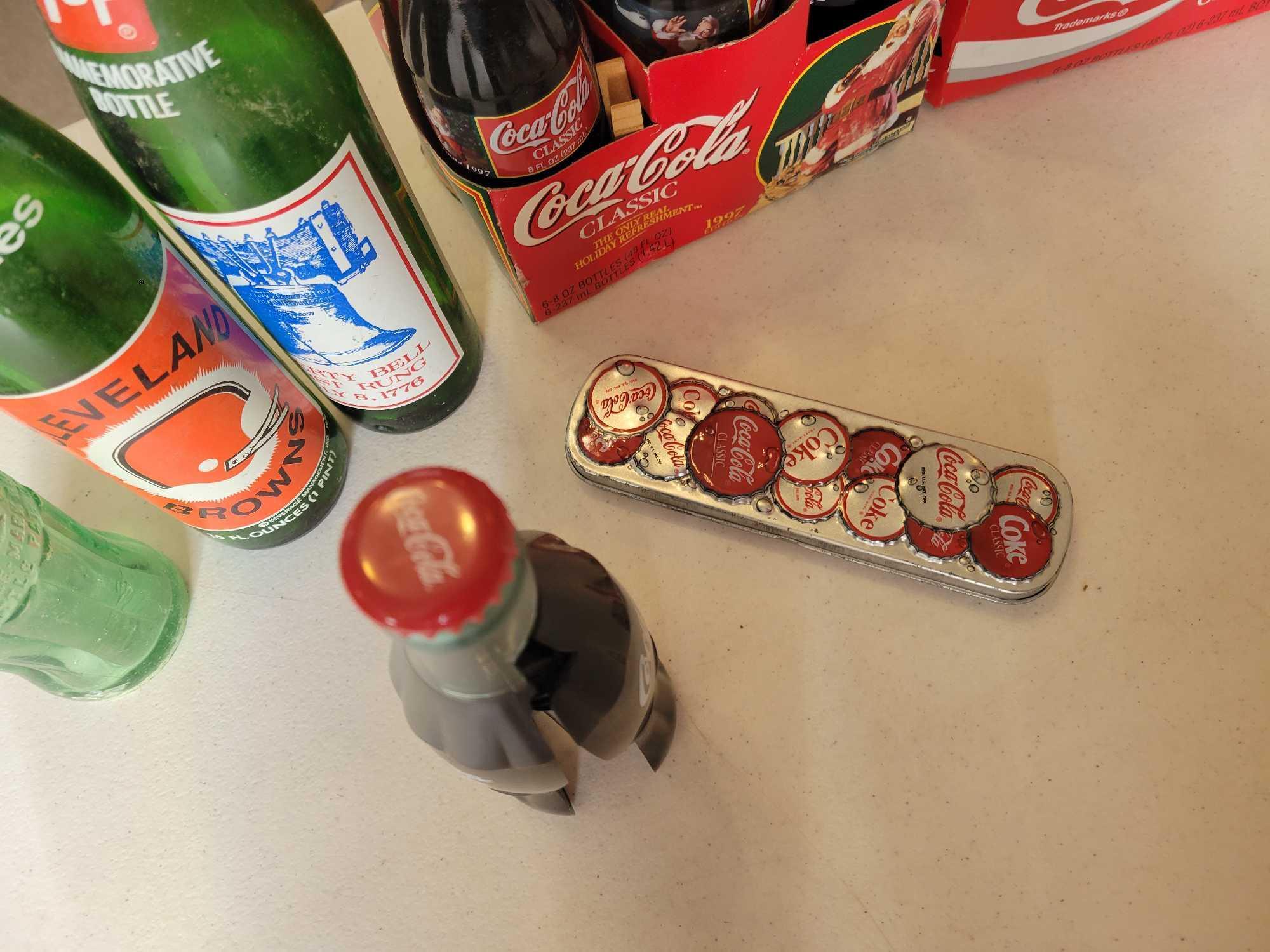 Collectible Coca Cola bottles, 7Up, Coke lamp and decor