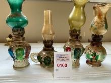 4 small oil lamps