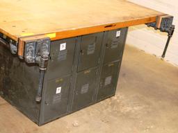 LARGE WORK TABLE WITH 4 VISES AND 12 LOCKERS UNDERNEATH