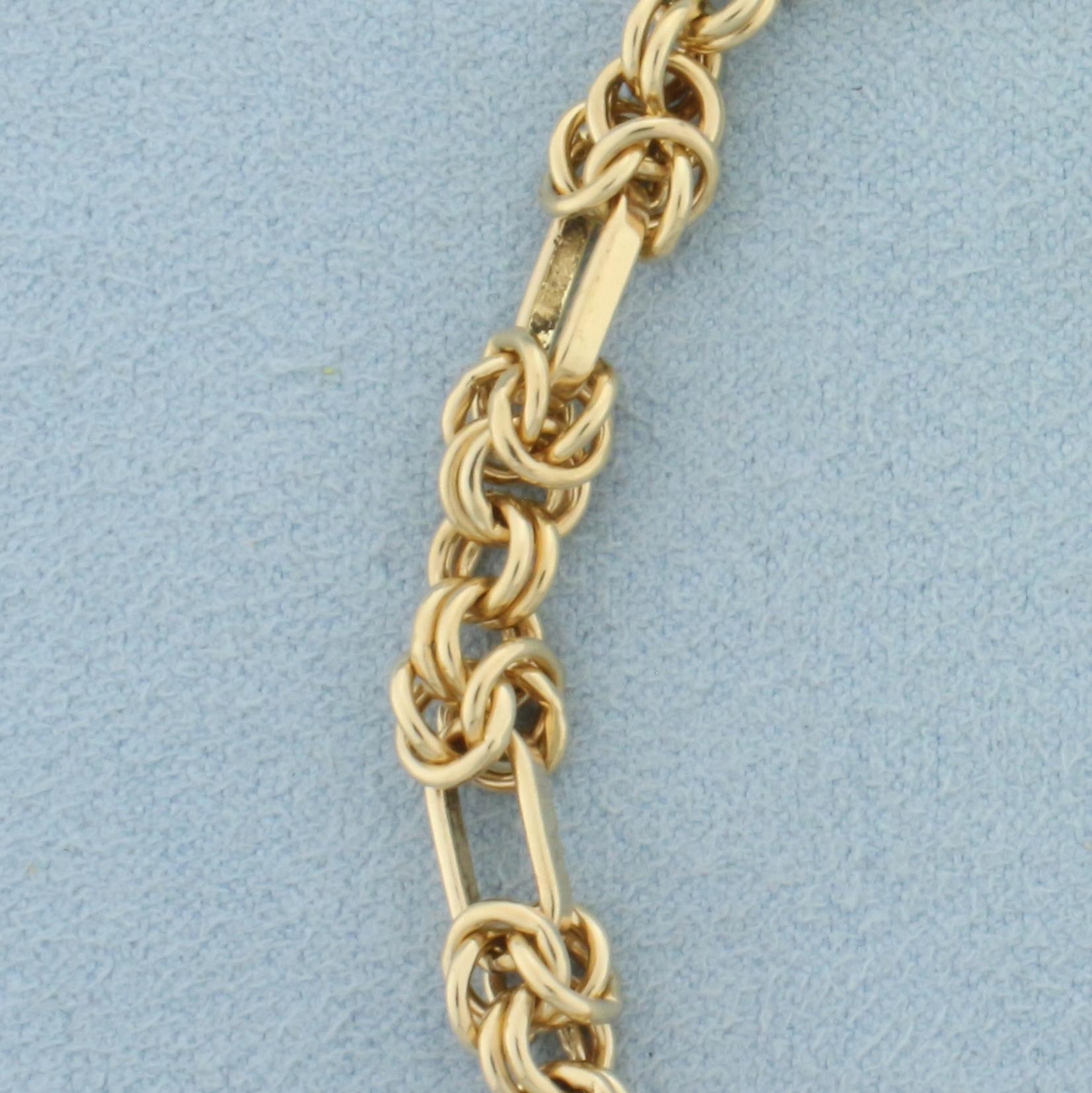 Italian Designer Knot And Oval Link Chain Bracelet In 14k Yellow Gold