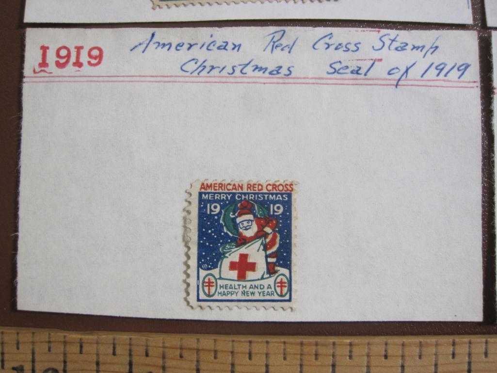 Eight early 1900s (1900-1930) Christmas Seals hinged to display cards