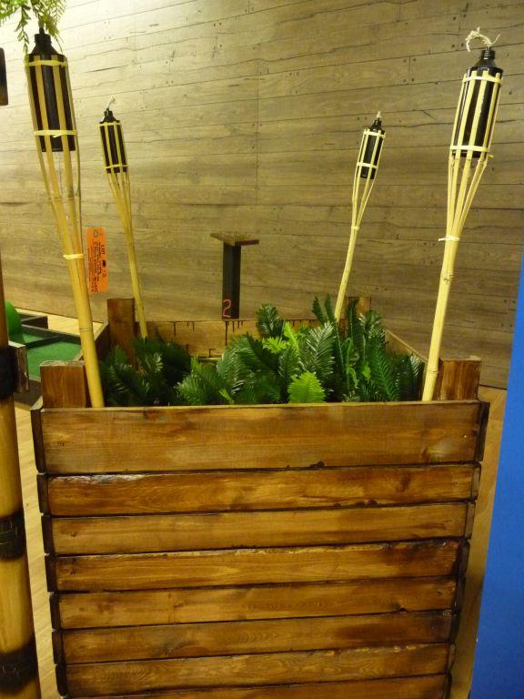 WOODEN CRATE WITH TIKI TORCHES AND FAUX PLANTS,