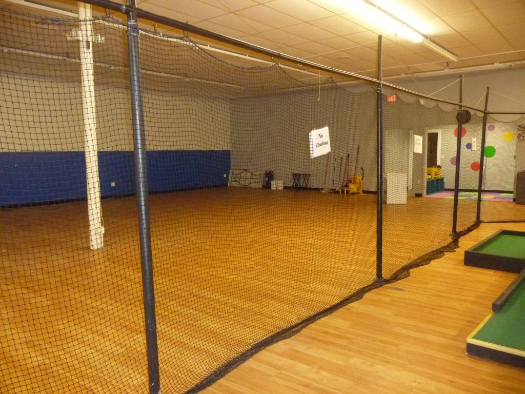 POLES WITH APPROXIMATELY 60' OF NETTING,