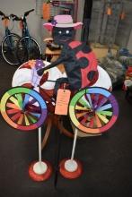 (2) CANDY CANE STANDS AND LADY BUG BIKER DECORATION