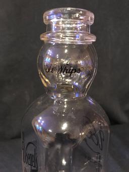 Voegel's antique milk bottle, with face.