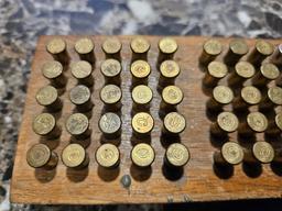 Variety of Different .22 Caliber Ammo in Wood Block Container (Remington, Winchester, Etc.…)