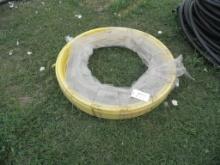 Roll of yeloow plastic pipe