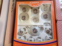 5 sets of China Toy tea sets. The blue set is missing a piece