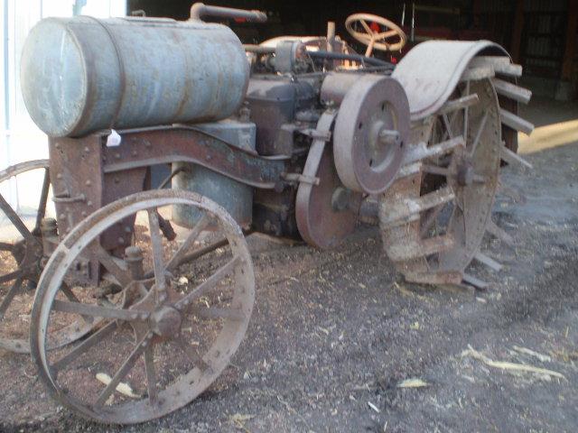 1020 Titan, complete, unrestored. Not running, engine is loose. Lugs for RR are there but not on rim