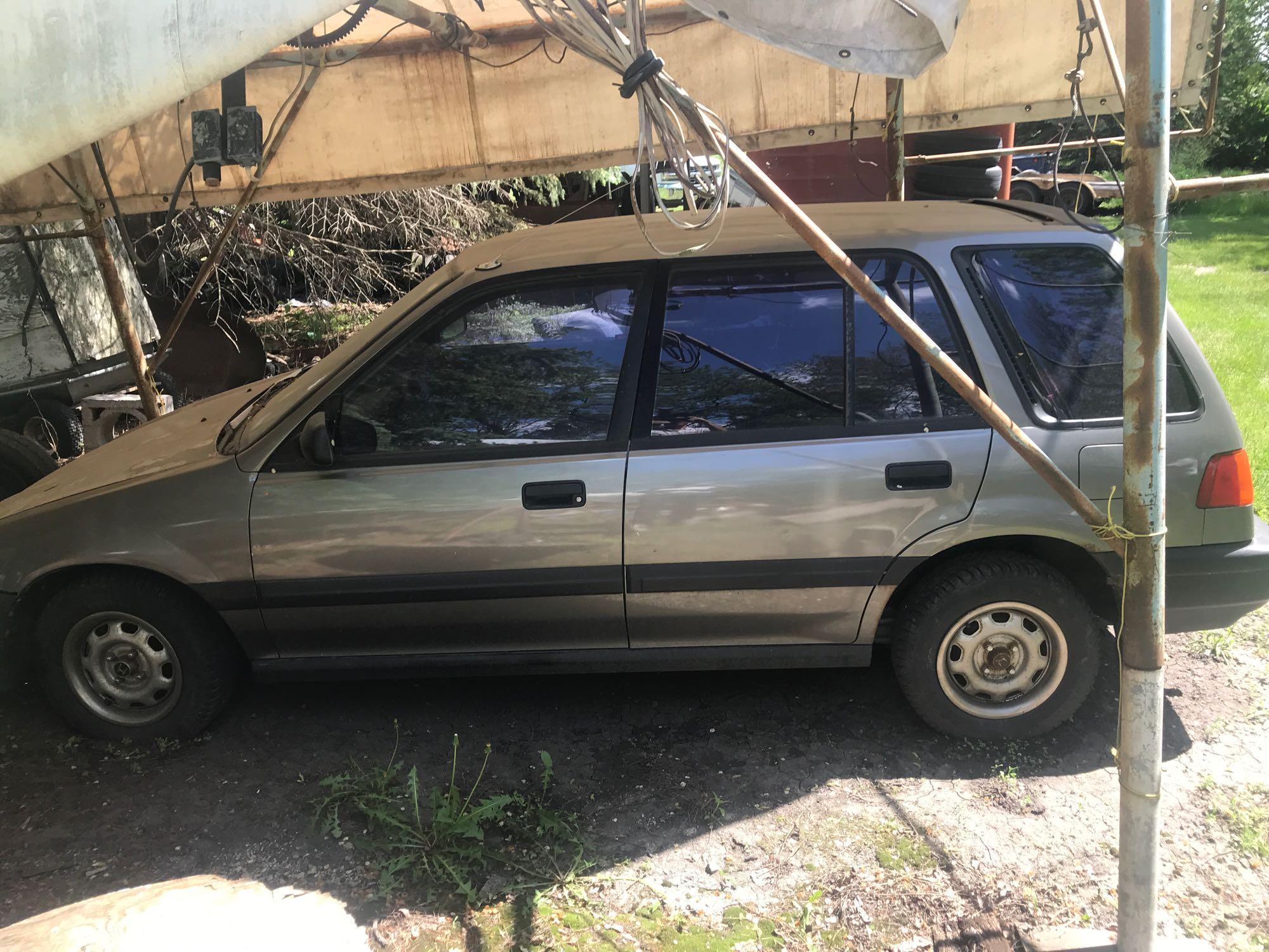 1990 Honda Civic w/auto on floor, bucket seats, a/c, 4 dr., 4 cyl, 188,960 miles, taupe