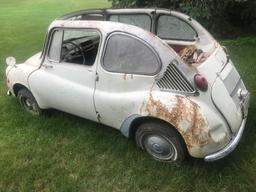 Subaru 360 deluxe car with soft top. Top is missing. Project car!