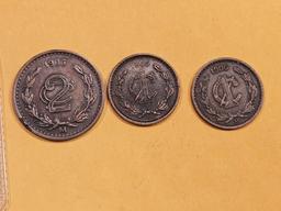 Three muy bueno Mexican coins