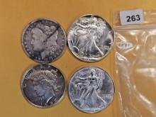 Four mixed Silver Dollars