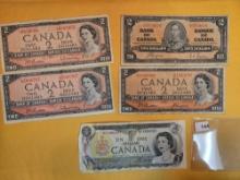 Five Canadian one and two dollar notes