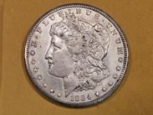 ** KEY DATE ** 1884-CC Morgan Dollar in About Uncirculated - 58 - details