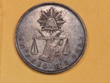 1872m Mexico silver un peso in About Uncirculated plus