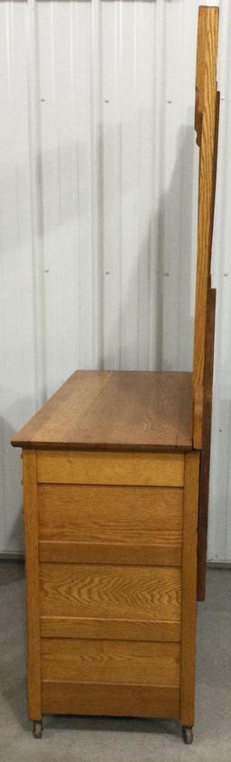 Antique three drawer dresser on casters with mirror