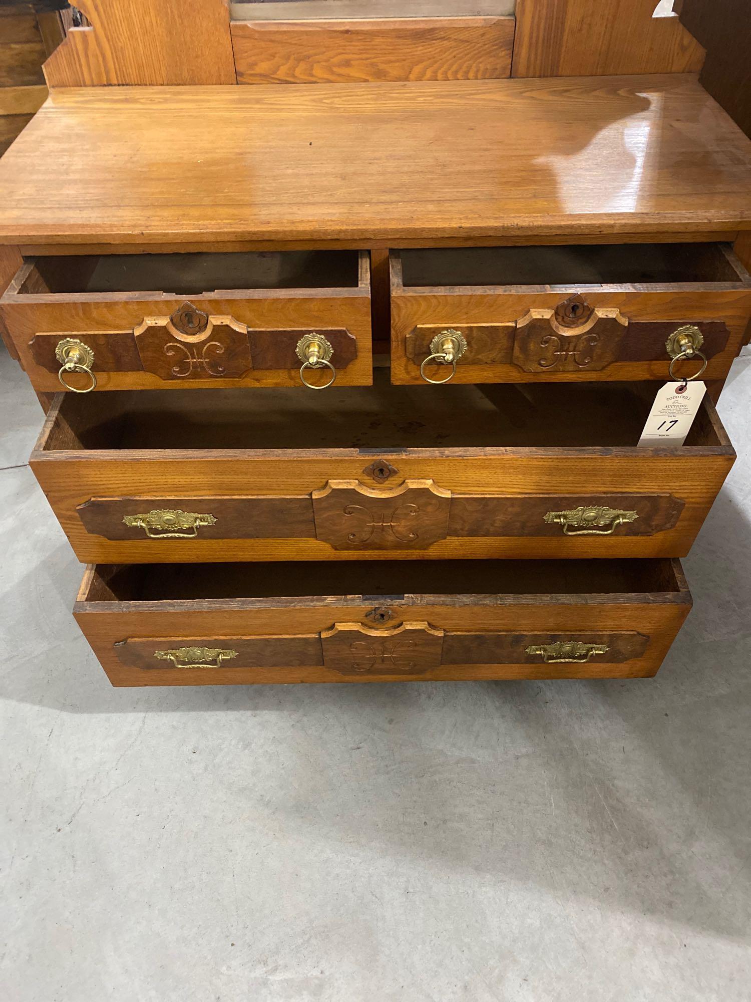 Antique four drawer dresser on casters with mirror