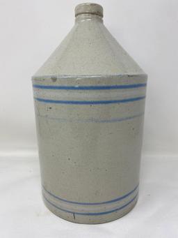 Antique white crock jug with blue and white lines
